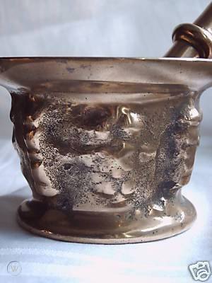 Bronze mortar and pestle with cherubs 1 116bc9a18c4f84e83584837e4c64b6ae